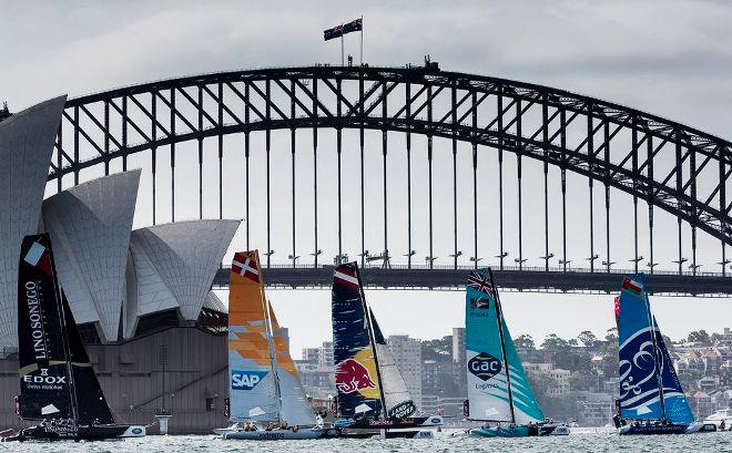 The Wave, Muscat lead the fleet as they race against the backdrop of the Sydney Harbour Bridge. - 2015 Extreme Sailing Series © Lloyd Images