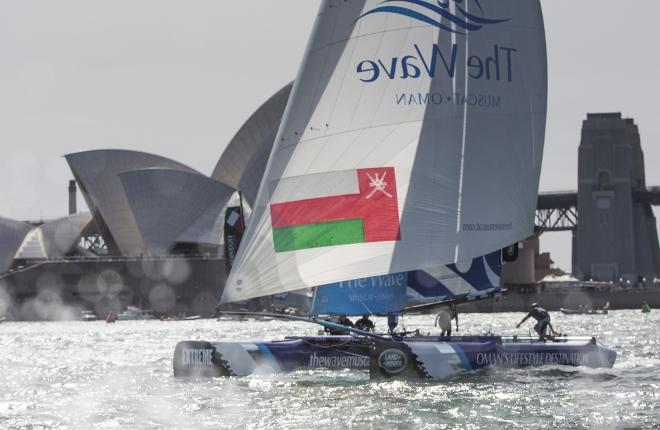Act 8. Sydney - Day two of racing in Sydney Harbour close to the shore. The Wave, Muscat skippered by Leigh McMillan (GBR) with team mates Pete Greenhalgh (GBR), Nasser Al Mashari (OMA), Sarah Ayton (GBR) , Ed Smyth (NZL/AUS) - 2015 Extreme Sailing Series © Lloyd Images