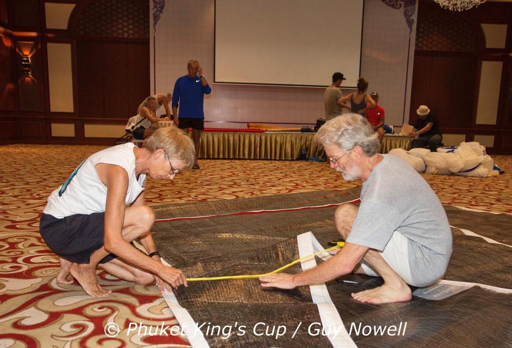 Measurers measuring. Nobody escapes the eagle eye of Malcolm Runnalls. Phuket King's Cup 2015 photo copyright Guy Nowell / Phuket King's Cup taken at  and featuring the  class