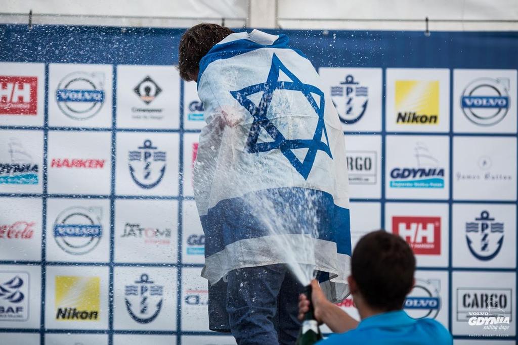 Yoav Omer is sprayed with champagne -  RS:X Class Youth World Championships, Gdynia, Poland © RS:X class.com http://www.rsxclass.com