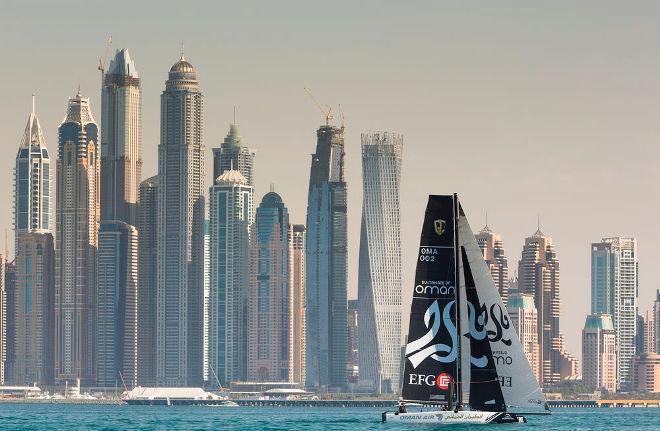 Oman Air sail against the backdrop of the Dubai skyline on the first day of training © Lloyd Images