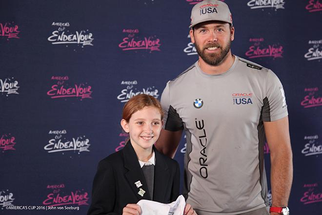 Oracle Team USA sailor Andrew Campbell congratulates Samantha Soares, one of five AC Endeavour graduates to be gifted an Optimist dinghy. © Oracle Team USA / John Von Seeburg