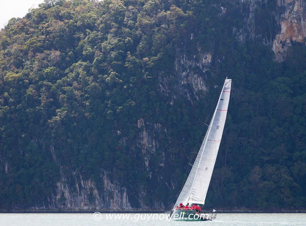 Millennium Racing under the cliffs of Pulau Bunting. Royal Langkawi International Regatta 2016. photo copyright Guy Nowell http://www.guynowell.com taken at  and featuring the  class