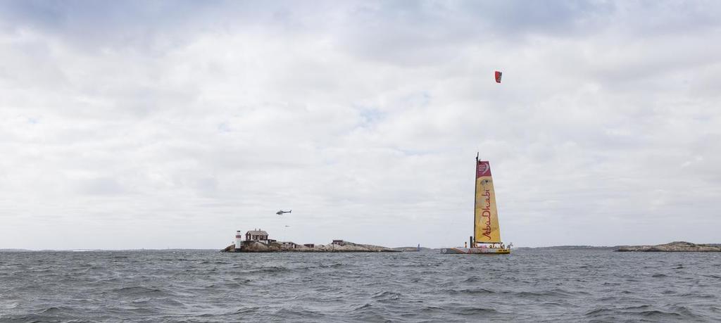 24th June 2015. Gothenburg, Sweden. Kitesurfer Nick Jacobsen jumps from the top of Abu Dhabi Ocean Racing's mast. ©  Ian Roman / Abu Dhabi Ocean Racing