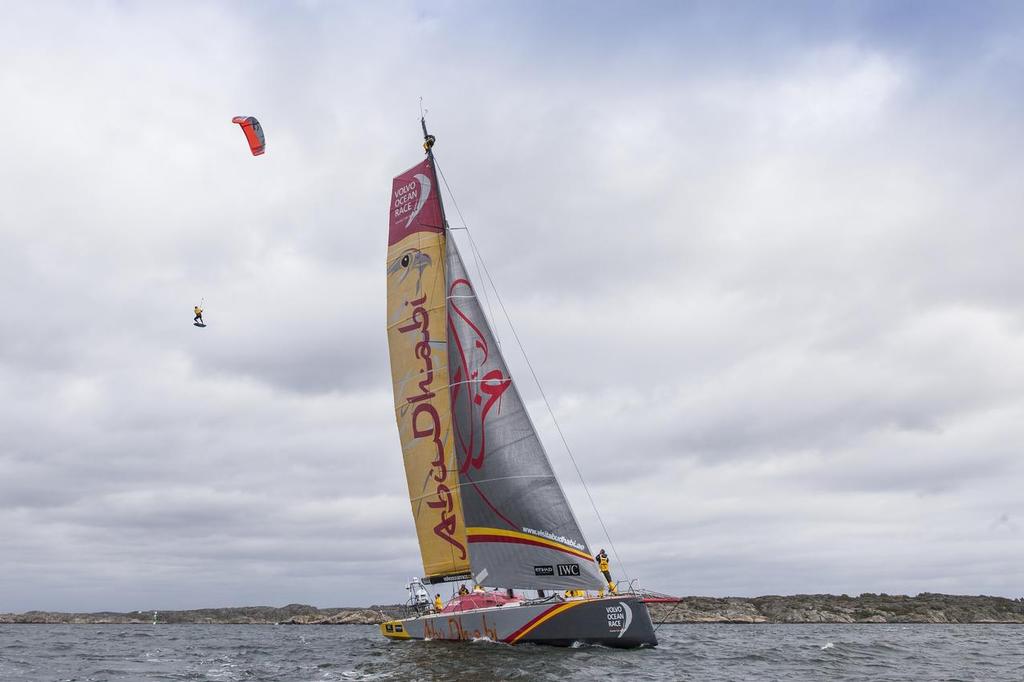 24th June 2015. Gothenburg, Sweden. Kitesurfer Nick Jacobsen jumps from the top of Abu Dhabi Ocean Racing's mast. ©  Ian Roman / Abu Dhabi Ocean Racing
