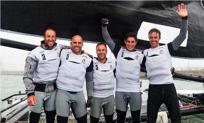 The crew of Alinghi, skippered by Arnaud Psarofaghis, celebrate their Act win on board their GC32 in Qingdao. © Aitor Alcalde Colomer