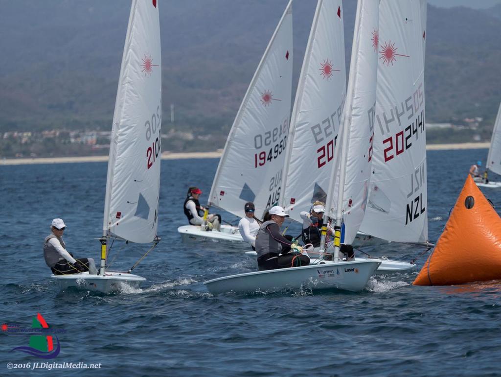 Sara Winther (obscured) round the windward mark - Day 1, 2016 Laser Radial Worlds, Vallarta Yacht Club, Mexico photo copyright Vallarta Yacht Club 2016JLDigitalMedia.net taken at  and featuring the  class