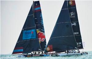 Red Bull Sailing Team and Sail Portugal go head to head during the only race of the opening day in Qingdao, China. photo copyright Aitor Alcalde Colomer taken at  and featuring the  class