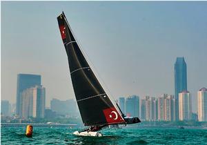 Team Turx fly a hull during racing on Fushan Bay in Qingdao photo copyright Aitor Alcalde Colomer taken at  and featuring the  class
