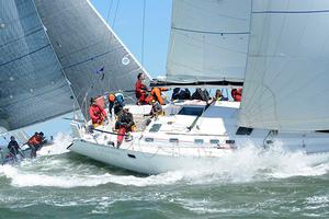 Steve Lesniak's Charleston-based Beneteau 510 Celadon is among the biggest boats at the event and even it's crew found the massive waves offshore to be a challenge on Day 2 of Sperry Charleston Race Week. photo copyright Tim Wilkes taken at  and featuring the  class
