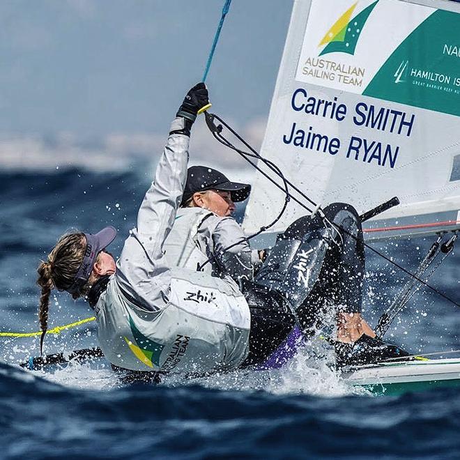 Working hard on their 470 Class Dinghy is Carrie Smith (helm) and Jaime Ryan (for’ard hand). © Beau Outteridge