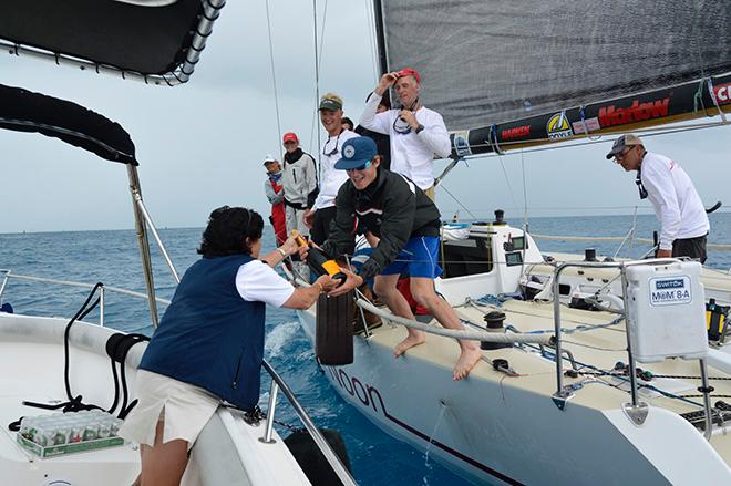 Royal Bermuda YC Commodore Leatrice Oatley hands over the victory champagne after HIGH NOON'S  winning crew had crossed the finish line.  © Barry Pickthall / PPL
