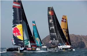 The fleet foil in close quarters in front of the Old Town on day one of racing in Muscat, Oman - 2016 Extreme Sailing Series photo copyright Lloyd Images taken at  and featuring the  class