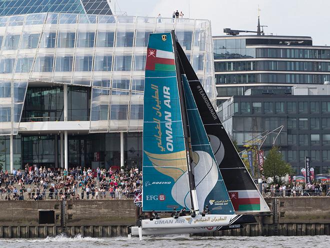Oman Air fly past the crowds gathered in Hamburg's HafenCity for the second days racing. - 2016 Extreme Sailing Series™ © Lloyd Images
