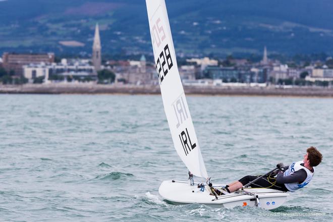 Ireland's Daniel Raymond from the National Yacht Club competing in the opening race in the KBC Laser Radial World Championships being hosted by the Royal St. George Yacht Club and Dun Laoghaire Harbour.<br />
 © David Branigan - Oceansport.ie