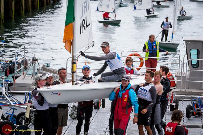 Dun Laoghaire Harbour, Saturday 30th July 2016:<br />
Ireland's Ewan McMahon is carried from the water in a traditional tribute after winning silver in the Youth event on the final day the KBC Laser Radial World Championships hosted by the Royal St. George Yacht Club and Dun Laoghaire Harbour.<br />
Photograph:  David Branigan/Oceansport © David Branigan/Oceansport http://www.oceansport.ie/
