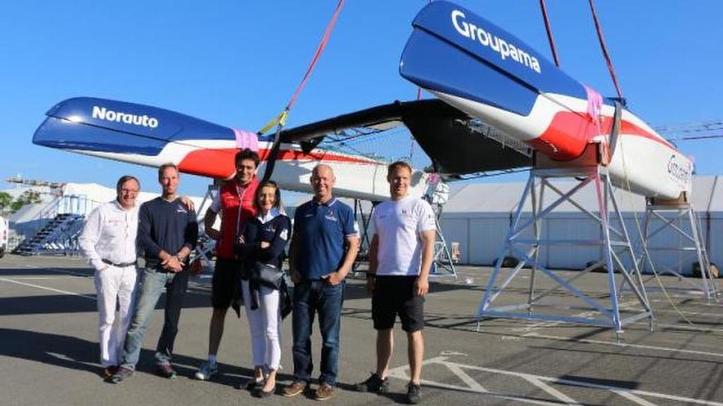 Groupama Team France team members pose with their AC45S which will be launched next week. The team has already started their AC50. Image Ouest-France.fr © SW