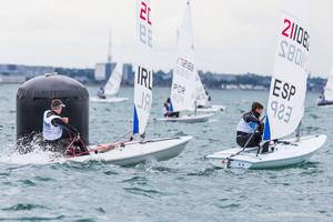 Andrew Mitchell from the County Antrim Yacht Club competing in the opening race of the KBC Laser Radial World Championships being hosted by the Royal St. George Yacht Club and Dun Laoghaire Harbour. photo copyright David Branigan - Oceansport.ie taken at  and featuring the  class