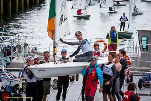 Dun Laoghaire Harbour, Saturday 30th July 2016:
Ireland's Ewan McMahon is carried from the water in a traditional tribute after winning silver in the Youth event on the final day the KBC Laser Radial World Championships hosted by the Royal St. George Yacht Club and Dun Laoghaire Harbour.
Photograph:  David Branigan/Oceansport photo copyright David Branigan/Oceansport http://www.oceansport.ie/ taken at  and featuring the  class