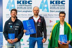 Dun Laoghaire Harbour, Saturday 30th July 2016:
Men's Radial World Champion Marcin Rudawski, Poland (centre) with Nik Pletikos, Slovenia (left) and Martin Manzoli Lowy, Brazil at the prize-giving for the KBC Laser Radial World Championships hosted by the Royal St. George Yacht Club and Dun Laoghaire Harbour.
Photograph:  David Branigan/Oceansport photo copyright David Branigan/Oceansport http://www.oceansport.ie/ taken at  and featuring the  class