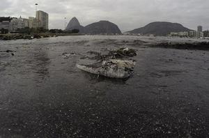 Trash floats on the water of Botafogo beach next to the Sugar Loaf mountain and the Guanabara Bay where sailing athletes will compete during the 2016 Summer Olympics in Rio de Janeiro, Brazil, Saturday, July 30, 2016. A recent investigation by Associated Press on water quality at aquatic venues for the 2016 Olympic Games in Rio de Janeiro, Brazil, has raised concerns about the risk to the health of athletes who will compete. The games start on August 5. photo copyright SW taken at  and featuring the  class