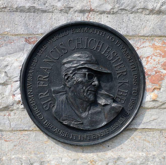 The new bronze plaque commemorating Sir Francis Chichester's pioneering solo circumnavigation set in the wall of the Waterfront Restaurant to replace the one washed away during a winter storm in 2014. © Barry Pickthall / PPL