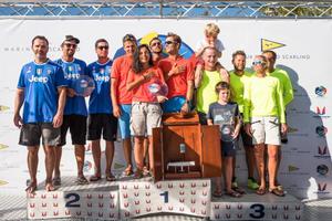 2016 Melges 20 Corinthian World Champion Emanuele Savoini and his Evinrude team celebrate winning the top-amateur trophy alongside second place Cesar Gomes Neto on Portobello (left) and Mirko Bartolini's Spirit of Nerina (right). - 2016 Melges 20 World Championship - 28 August, 2016 photo copyright Barracuda Communication taken at  and featuring the  class