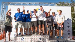 2016 Melges 20 World Champion Michael Illbruck and his Pinta team proudly accept the title trophy, alongside of runner-up Drew Freides on Pacific Yankee (left) and third place Krzysztof Krempec's Mag Tiny (right). - 2016 Melges 20 World Championship - 28 August, 2016 photo copyright Barracuda Communication taken at  and featuring the  class