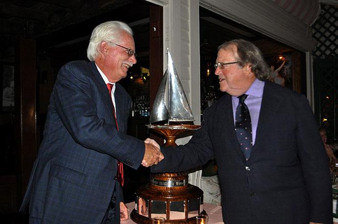 Dennis Williams, skipper of Victory ’83, accepts the Ted Turner Trophy from Jimmy Gubelmann, Commodore of the 12 Metre Yacht Club, during the club’s annual dinner held on Thursday, September 22. © SallyAnne Santos