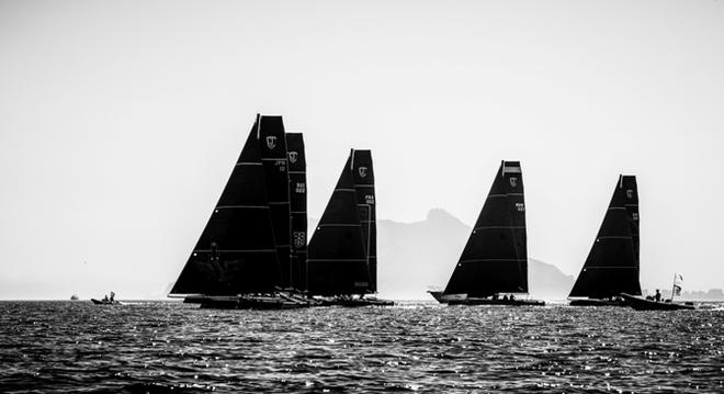 The fleet silhouetted against Gibraltar - GC32 La Reserva de Sotogrande Cup © Jesus Renedo / GC32 Racing Tour
