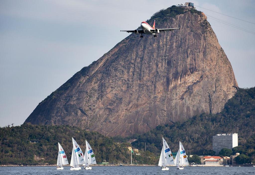 Sonars race towards the 400 metres (1300ft) high Sugarloaf in the only Northerly breeze of the regatta. The prevailing southerly breeze comes from directly behind the marble and granite mass and passes around each side - 2016 Paralympics, Rio de Janeiro. © Richard Langdon / World Sailing