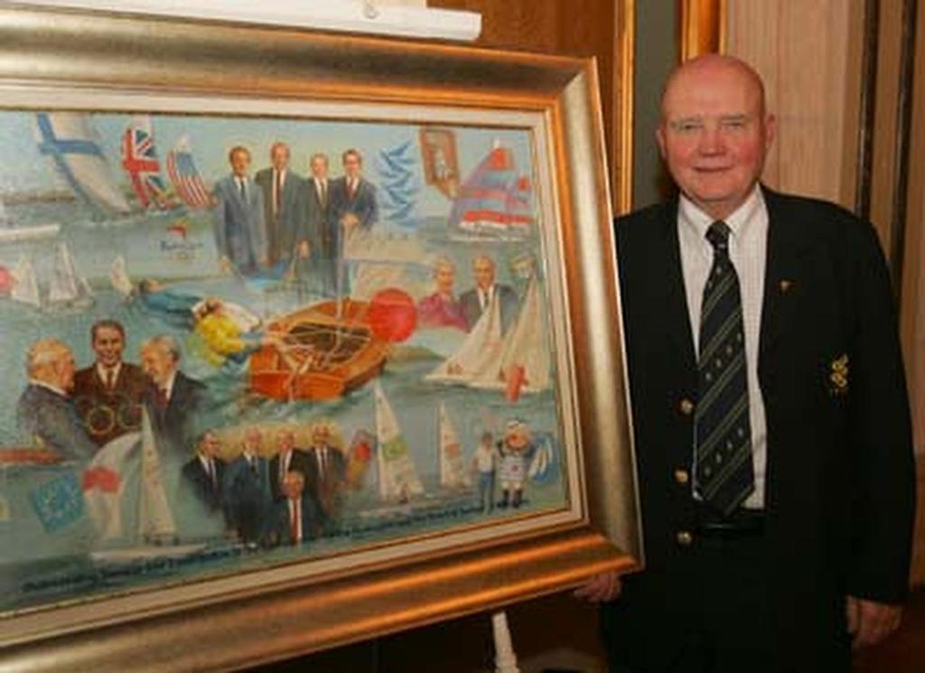 Paul Henderson with a painting presented by ISAF depicting his sailing life over his 34 years of service to Sailing. © SW