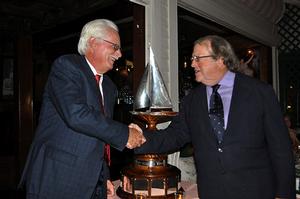 Dennis Williams, skipper of Victory ’83, accepts the Ted Turner Trophy from Jimmy Gubelmann, Commodore of the 12 Metre Yacht Club, during the club’s annual dinner held on Thursday, September 22. photo copyright SallyAnne Santos taken at  and featuring the  class