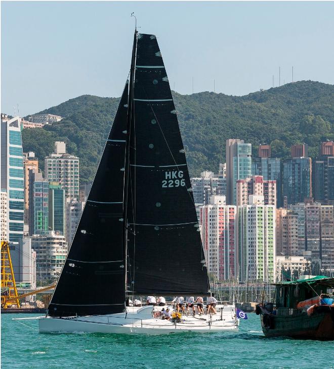 Black Baza and a fishing boat - Volvo Hong Kong to Hainan Race ©  RHKYC/Guy Nowell http://www.guynowell.com/