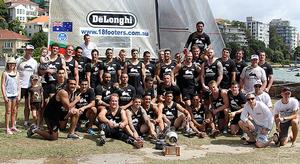 2014 National Rugby League chhampion South Sydney team with the De'Longhi skiff and JJ Giltinan Trophy photo copyright Frank Quealey /Australian 18 Footers League http://www.18footers.com.au taken at  and featuring the  class