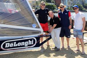Gregg Lawrance of De'Longhi pours the traditional champagne over the new skiff in the Double Bay rigging area photo copyright Frank Quealey /Australian 18 Footers League http://www.18footers.com.au taken at  and featuring the  class