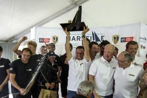 Franck Cammas and crew accept the winner's spoils. - GC32 Racing Tour - 16 October 2016 photo copyright Sander van der Borch / Bullitt GC32 Racing Tour taken at  and featuring the  class