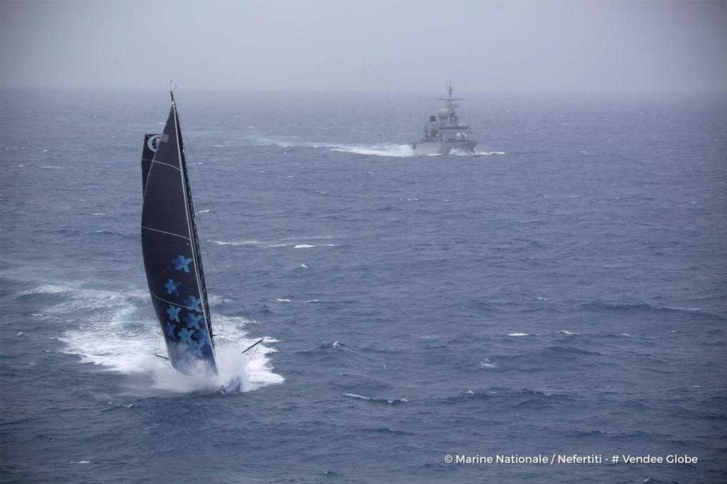 Banque Populaire VIII, skipper Armel Le Cleac’h (FRA), off the Kerguelen Islands, flown over by the National French Marine Nivose Frigate, during the Vendee Globe, solo sailing race around the world, on November 30th, 2016  © Marine Nationale / Nefertiti / Vendee Globe vendeeglobe.org