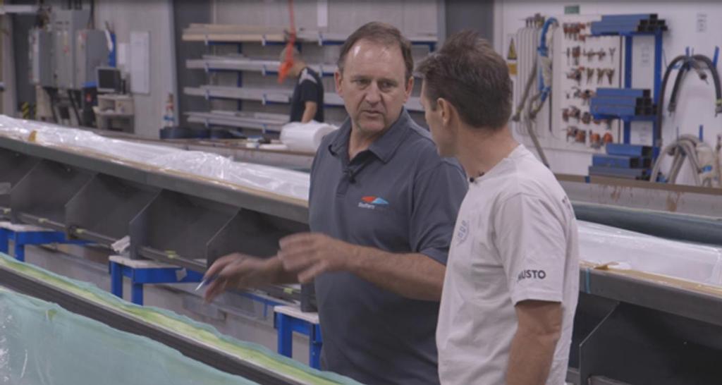 Lance Manson, project manager in charge of the VO65 rigs, shows Fernando Sales from the VOR Boatyard the lamination progress on VO65 rig number 16. © Southern Spars