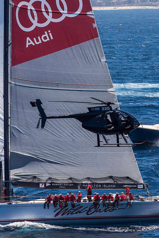 His signature shot - Wild Oats XI and a chopper. - 2016 Rolex Sydney Hobart Yacht Race © Andrea Francolini