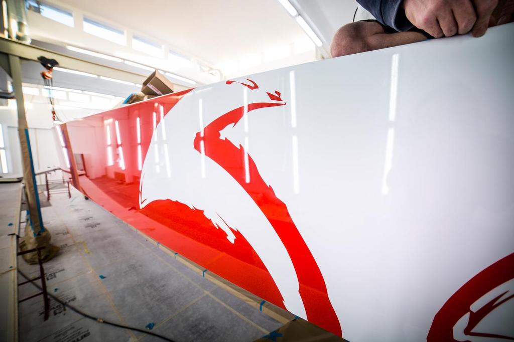 Boat One, Dongfeng getting the final retouches and new logo after being clear coated. ©  Amalia Infante / Volvo Ocean Race