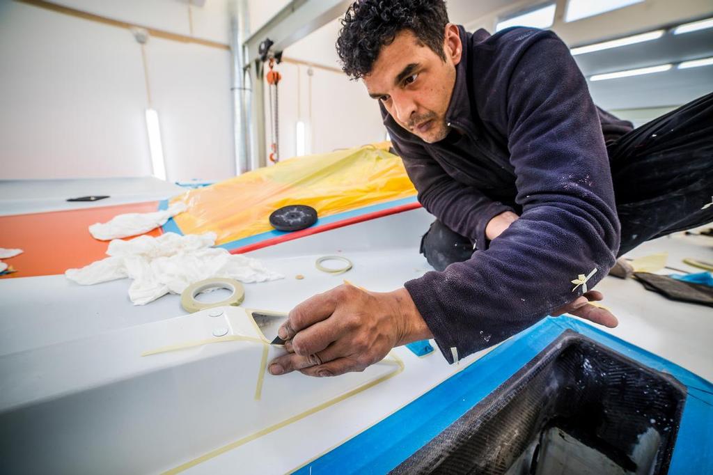 Boat One, Dongfeng getting the final retouches after being clear coated. ©  Amalia Infante / Volvo Ocean Race