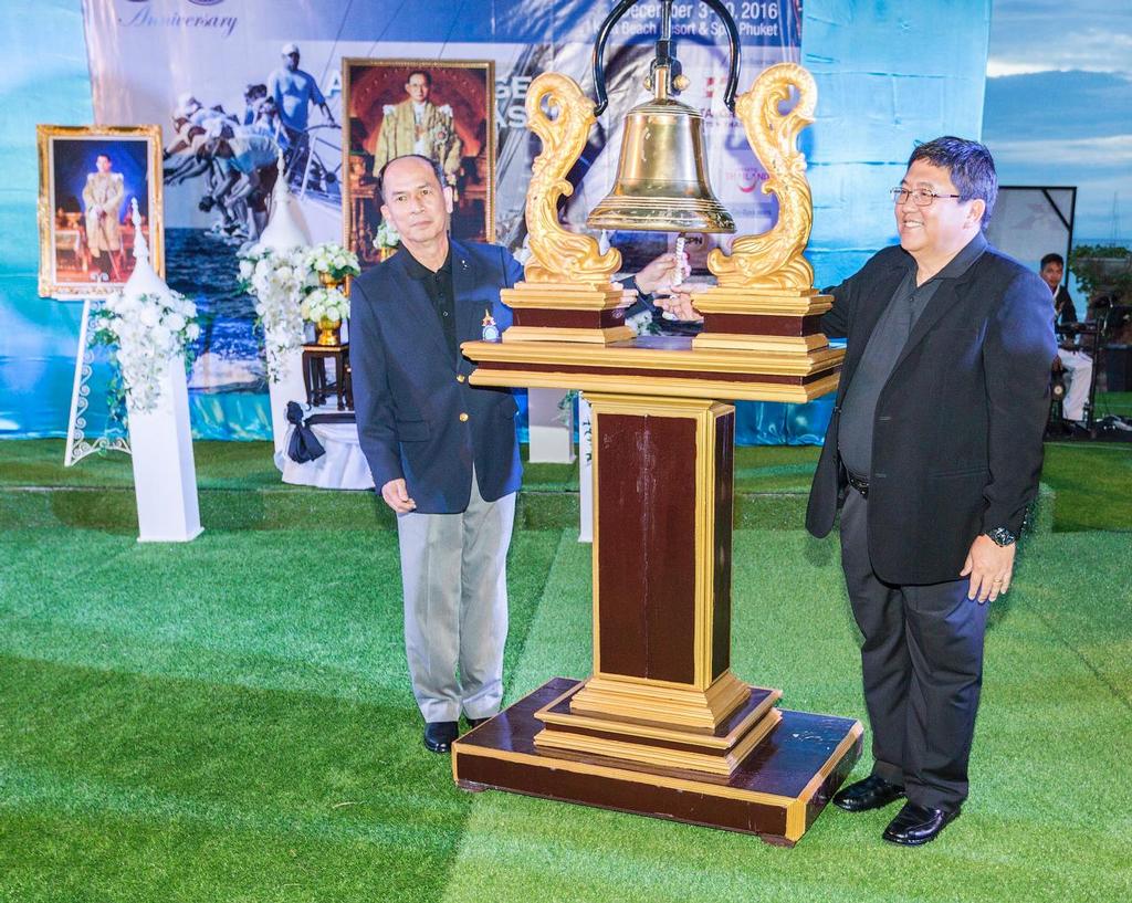 Admiral Photchana Phuekphong, Vice President of YRAT and Chokchai dej Amornthan, Governor of Phuket ring the bell to signal the opening of the King's Cup. Phuket King's Cup 2016. © Guy Nowell / Phuket King's Cup