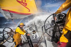 March 19, 2015. Leg 5 to Itajai onboard Abu Dhabi Ocean Racing. Day 01.  Luke ``Parko`` Parkinson braces for the next wave as Phil Harmer drives deeper into the Southern Ocean. photo copyright Matt Knighton/ Abu Dhabi Racing/Volvo Ocean Race taken at  and featuring the  class