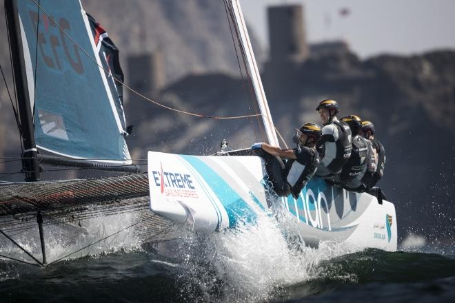 The fleet racing close to the shore and historic town of Mutrah - Extreme Sailing Series © Lloyd Images http://lloydimagesgallery.photoshelter.com/