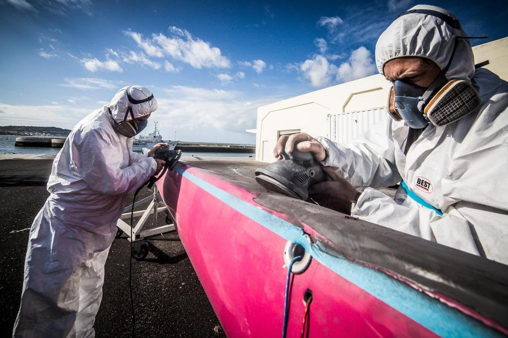 Spar maintenance is undertaken at one of the 2014/15 Volvo Ocean race stopovers on a Team SCA rig. © Volvo Ocean Race http://www.volvooceanrace.com