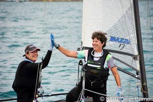 The team aboard Nacra 17, Flight Risk, with Teri McKenna (right) as crew give a high five after racing. photo copyright Dean Barnes taken at  and featuring the  class