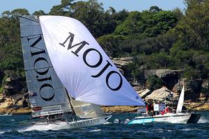 Mojo Wine races past the club's video team on board the camera cat - 18ft Skiffs: Queen of the Harbour & Alice Burton Memorial Trophy 2017 photo copyright 18footers.com taken at  and featuring the  class