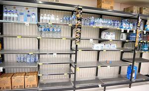 Supermarket shelves are nearly empty as people prepare for the cyclone photo copyright Getty Images taken at  and featuring the  class