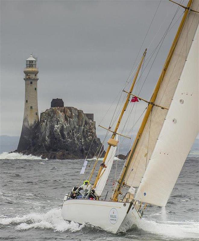 The 52-foot American yawl, Dorade - two-time winner of the Fastnet Race in the 1930s - rounding legendary Fastnet Rock during the 2015 Rolex Fastnet Race. ©  Rolex/Daniel Forster http://www.regattanews.com